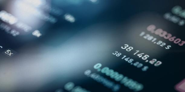 Close-up of financial market data and trading figures on a digital screen