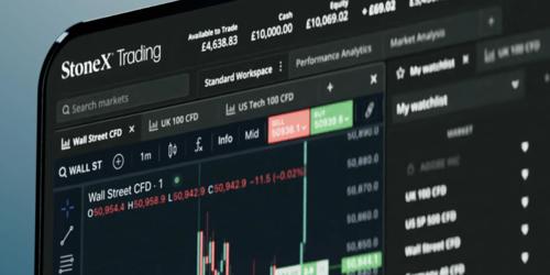 A laptop screen displaying the StoneX Market Intelligence dashboard