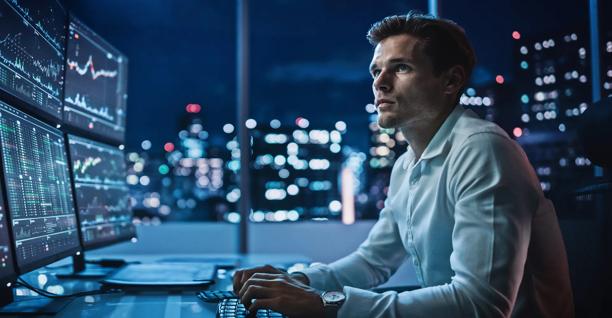 Financial professional looking at city skyline, representing StoneX Global Prime Services' comprehensive prime brokerage solutions.