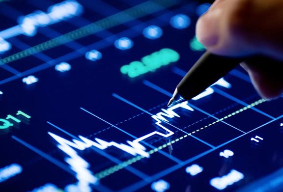 Close-up of a hand pointing at a digital stock market chart with data analysis.