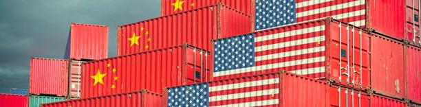 colourful shipping containers stacked at port with Chinese flag, symbolizing China’s exports and global trade