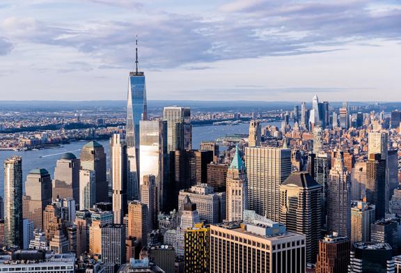 Aerial view of downtown Manhattan skyline with One World Trade Center and Hudson River