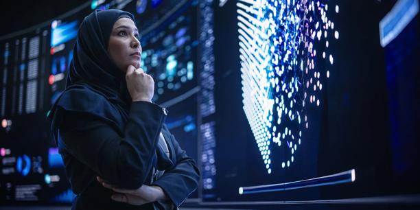 Businesswoman analyzing global data visualizations on a digital intelligence screen