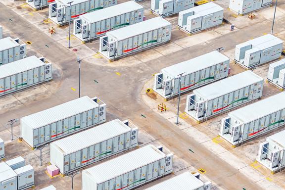 Aerial view of large-scale battery energy storage systems (BESS) in container units, designed for renewable energy integration, grid stability, and efficient power management.