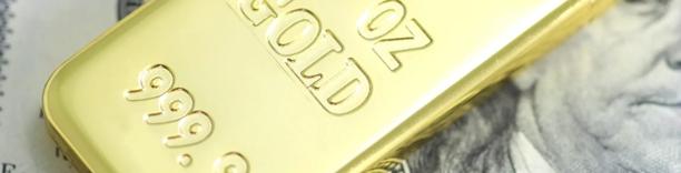 Gold bar engraved with weight and purity markings, symbolizing precious metals investment