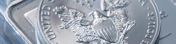 Silver coin with US emblem, symbolizing currency, minting, and financial security