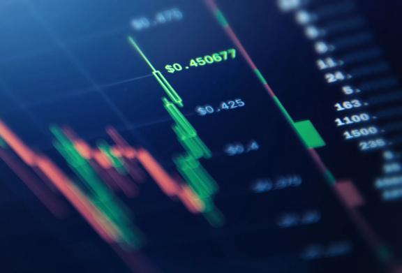 Close-up of digital candlestick chart displaying real-time cryptocurrency or stock price fluctuations
