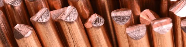 Stack of copper rods with polished ends, representing industrial metals and commodity trading