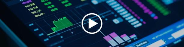 Financial trading dashboard with market charts and data, overlaid with a video play button.